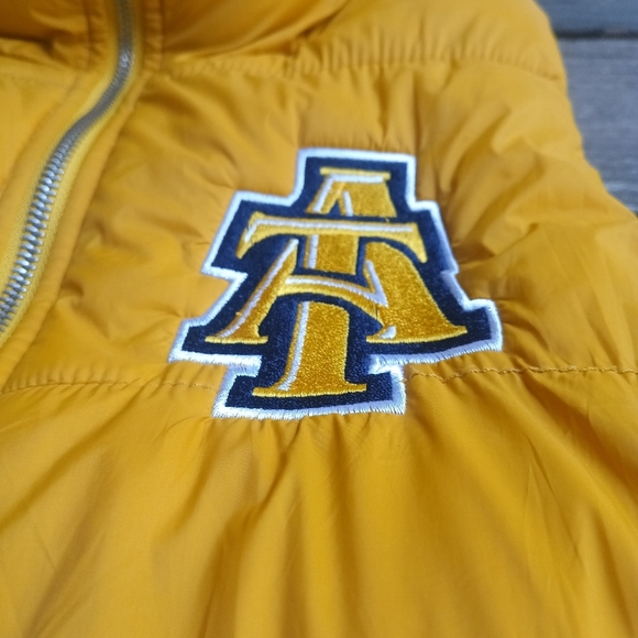 North Carolina A&T Big Logo Yellow Blue Puffer Vest Men's Size Small - Picture 2 of 6
